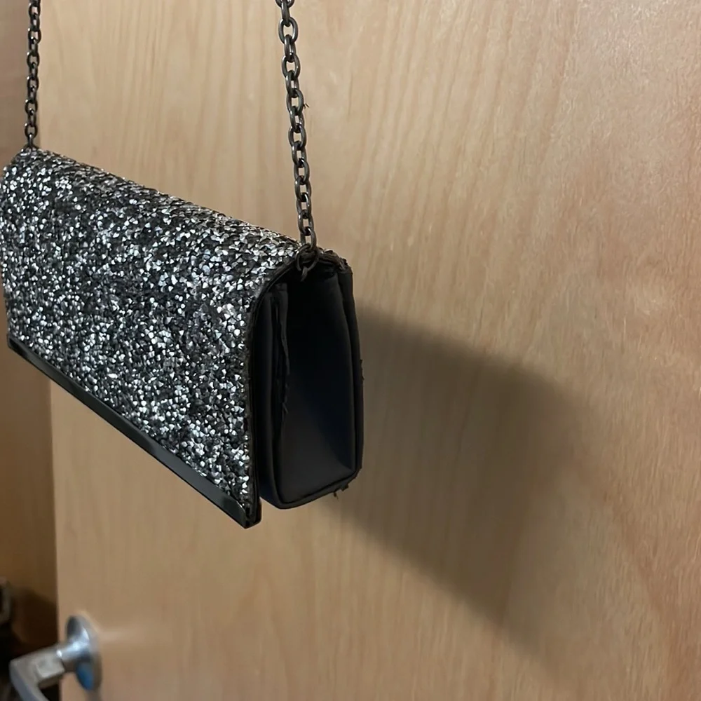 Saks Fifth Avenue sparkly gemstones clutch with chain link strap.